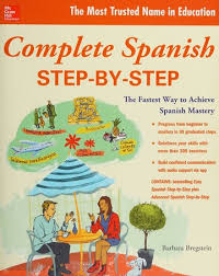 A student using the "Complete Spanish Step-by-Step" book